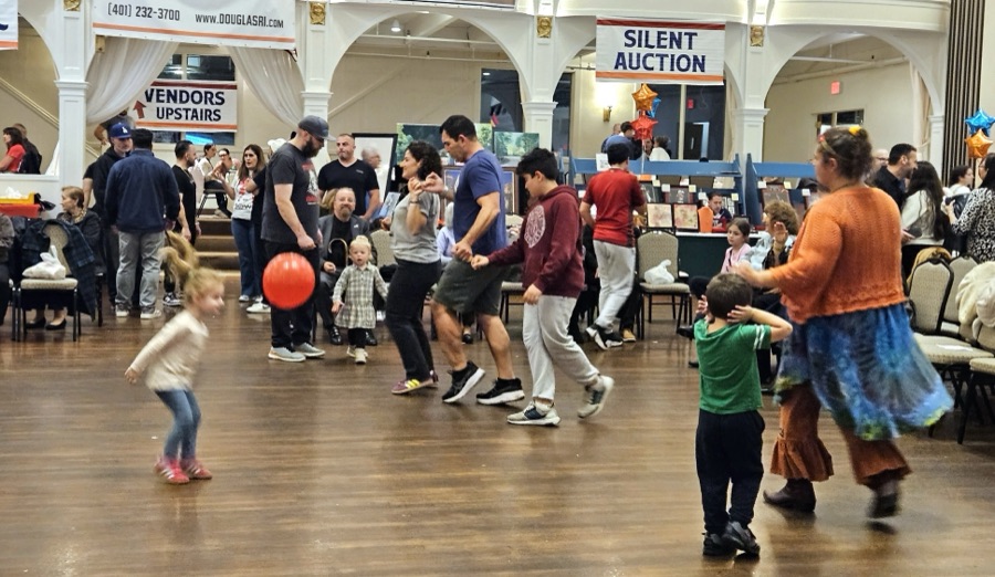Kids dancing with balloons on the ballroom floor
