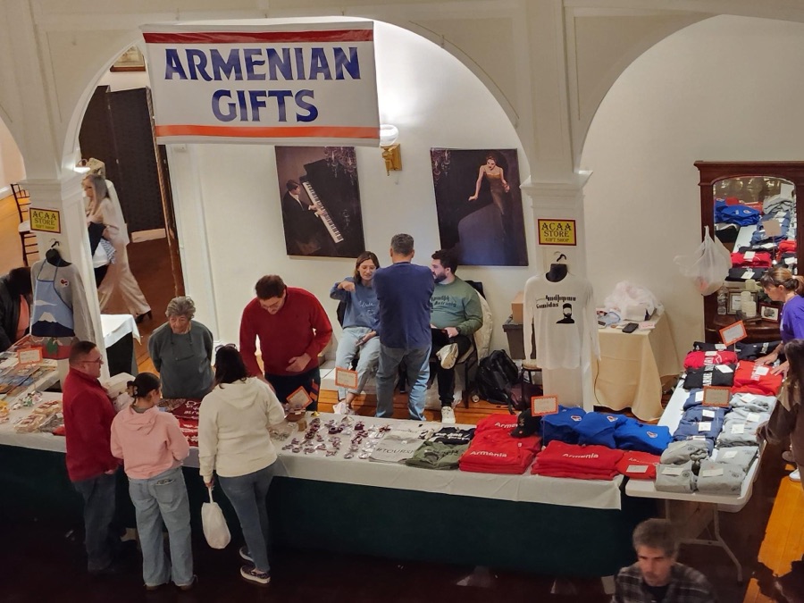 Shoppers browsing the Armenian gifts table