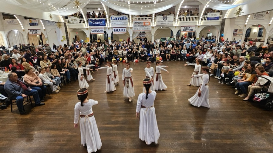 Young dancers performing for a packed ballroom