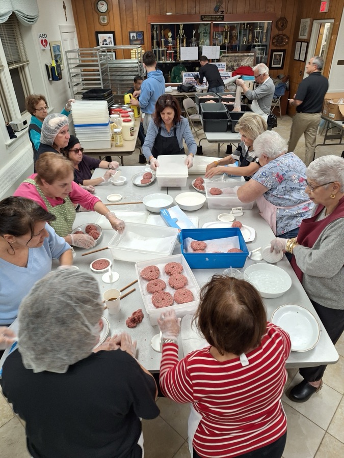 Volunteers hand-rolling kufteh